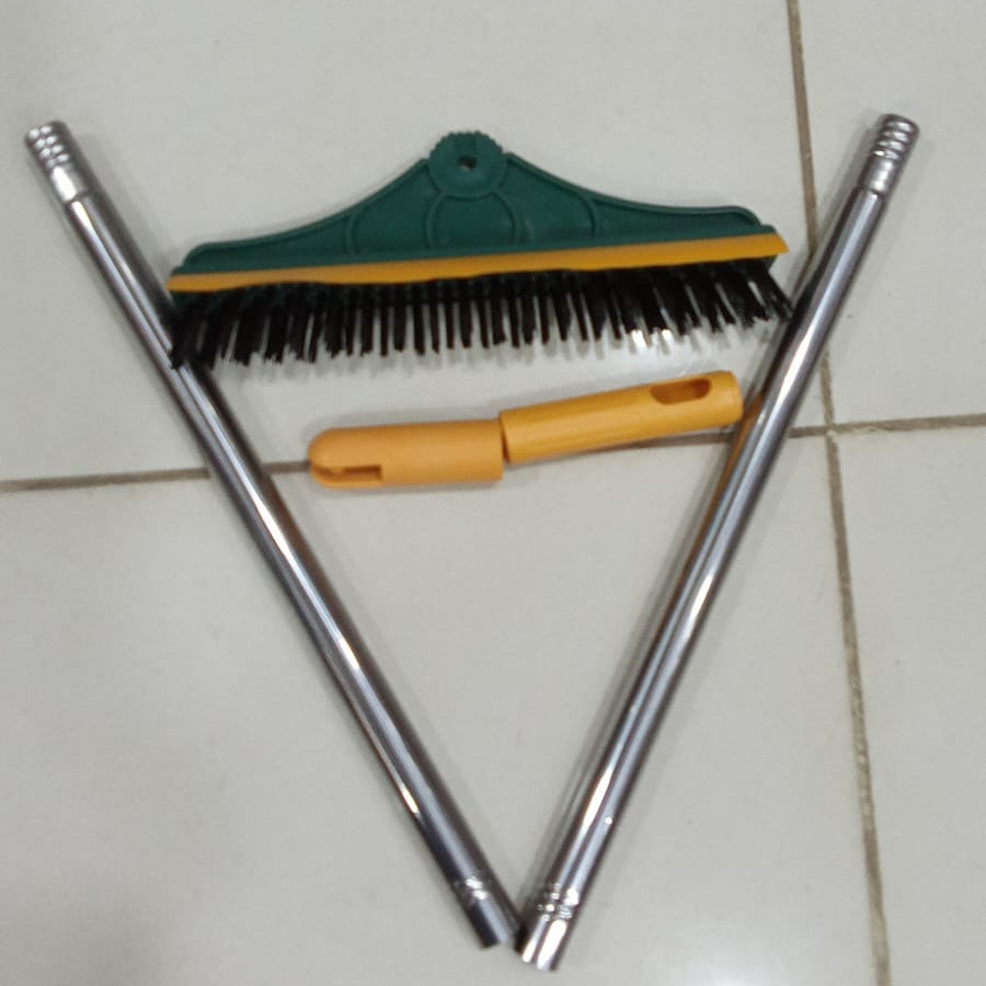 strong bristle broom wiper removing dust and water from floor