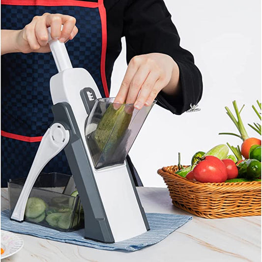 Mandoline vegetable slicer cutting potatoes and vegetables quickly in home kitchen Pakistan