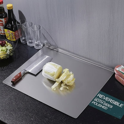 Stainless steel cutting board for meat vegetables and dough in Pakistani kitchen