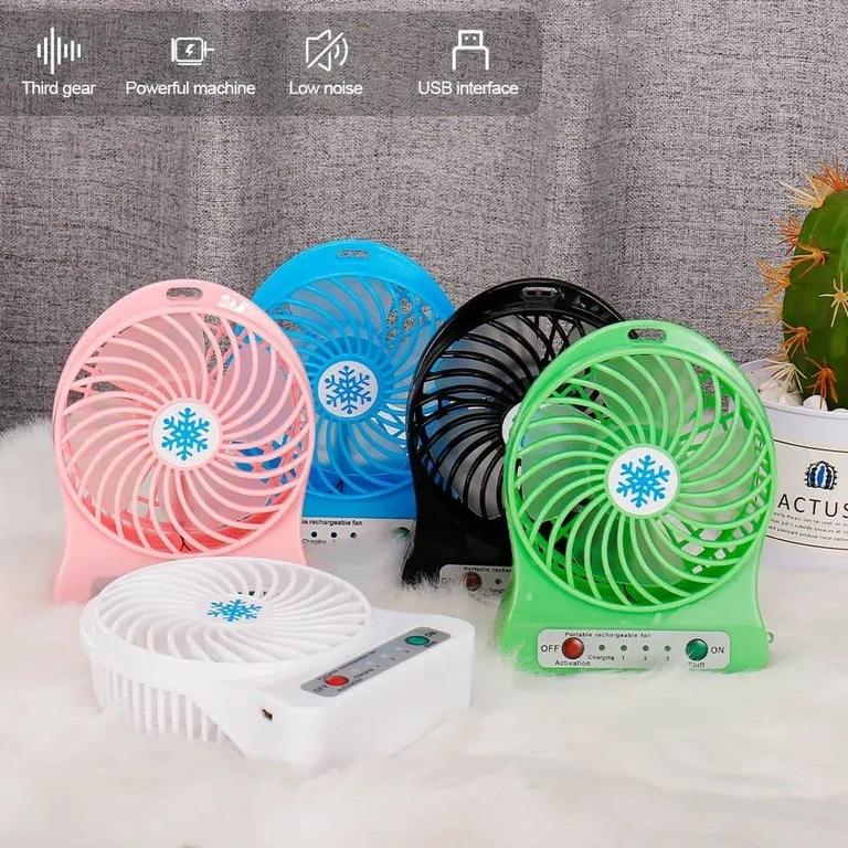 Compact USB fan placed on study table for personal cooling in Pakistan