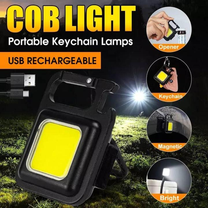 Portable metal mini LED flashlight attached to keychain for emergency lighting
