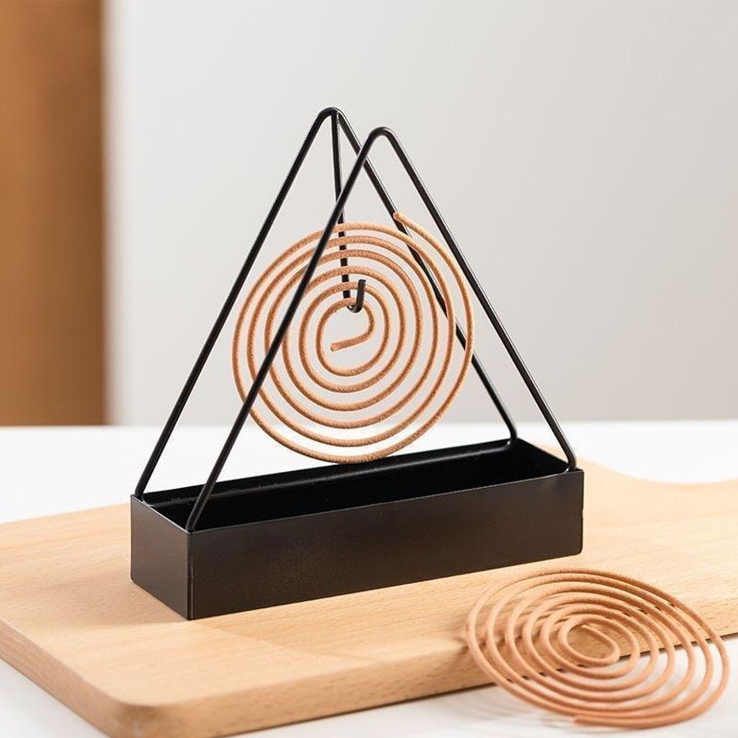 Metal mosquito coil holder with ash catcher for safe indoor and outdoor use in Pakistan